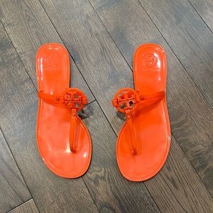 Orange Tory Burch jelly sandals